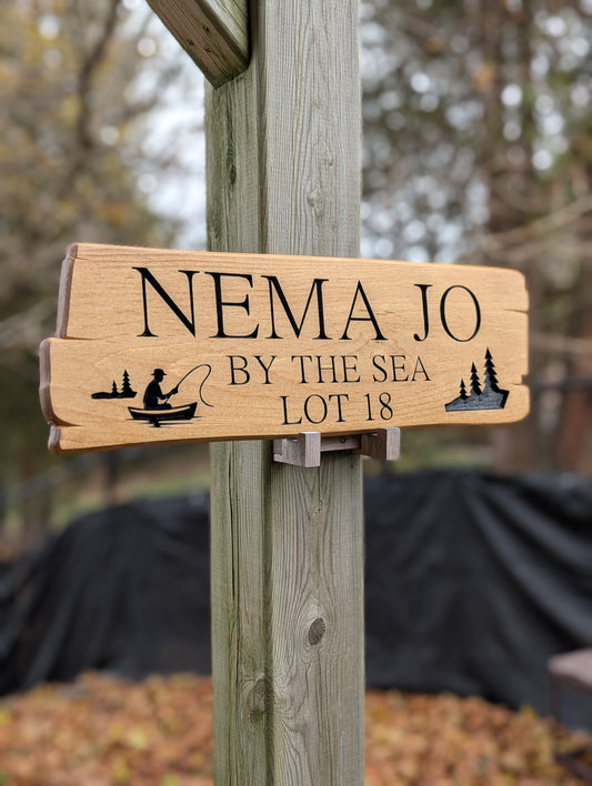Custom Cabin Wood Sign: Personalized Outdoor Sign with Fisherman graphics.