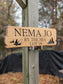 Custom Cabin Wood Sign: Personalized Outdoor Sign with Fisherman graphics.
